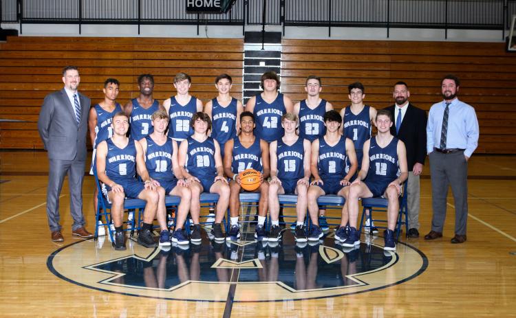 Members of the White County Warriors basketball team are, front from left, Reece Dockery, Rylee Higgins, Alex Thornton, Will Sampson, Marty James, Dylan Sargent, and Jimmy King; back row, head coach Wade Mawdesley, Darius Cannon, Silas Mulligan, Kenny Simpson, Jadon Yeh, JD Trowell, Cooper Turner, Riley Egerton, assistant coach Robbie Bailey, and assistant coach Chris Black. (Photo/Staci Sulhoff)