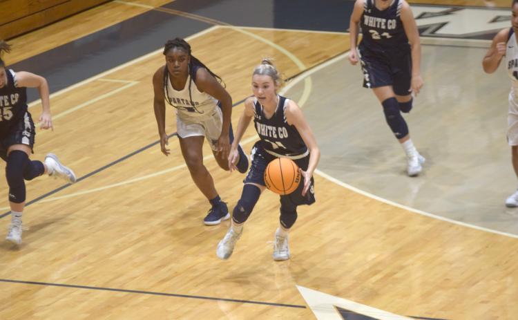 Naomi Crumley pushes the ball up the court during the Lady Warriors' region win over West Hall Tuesday night in Oakwood. (Photo/Mark Turner)