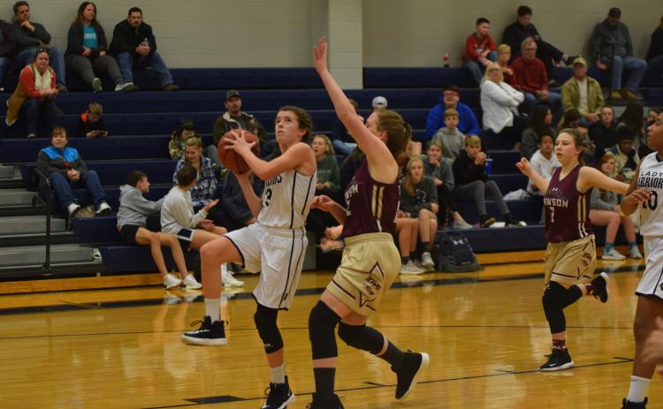 Paisley Cathey goes up for a layup during the WCMS seventh-grade girls win over Dawson County. The Lady Warriors are 7-0 this season. (Photo/Mark Turner)