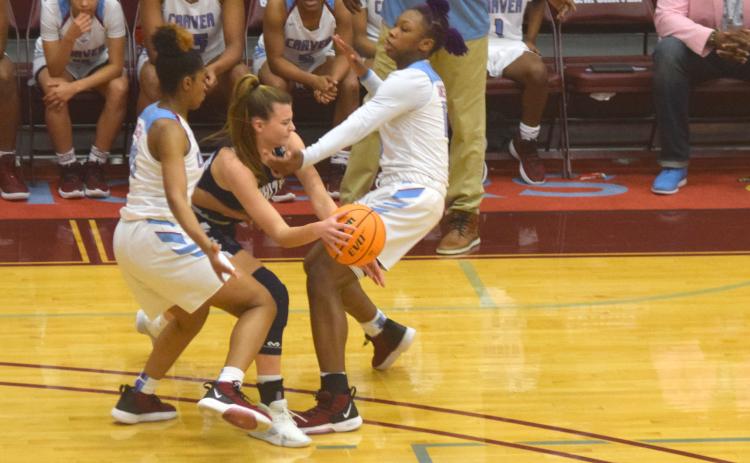 Ellie Gearing tries to make a pass out of a double-team during the Class AAAA playoff game last week in Columbus. (Photos/Mark Turner)
