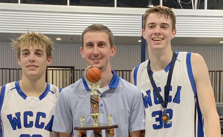 White Creek's Jim Fuller, left, head coach Preston Bowen, and Cameron Hay show off the tournament hardware after winning the Knight's Court Classic. (Photo/WCCA)