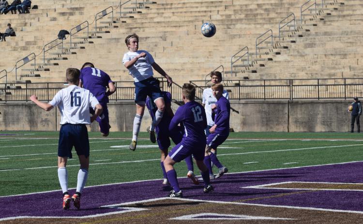 Andrew Pierce lands a header during the match with Lumpkin County. Pierce scored the winning goal in the second half. (Photo/Mark Turner)
