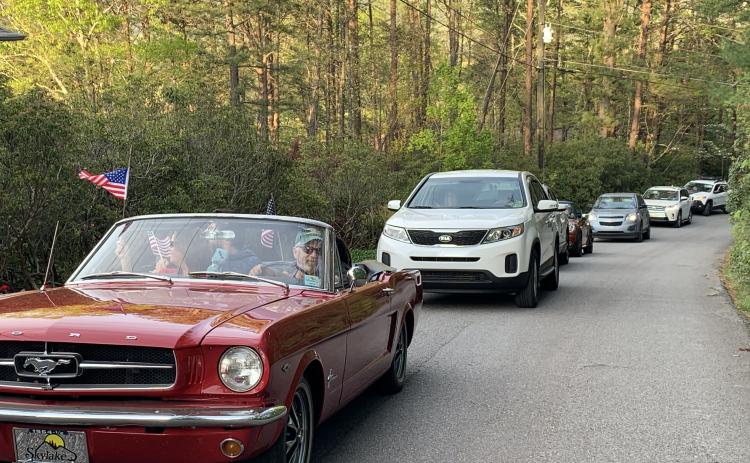 A caravan of neighbors drives by a first responder’s house. (Photo/Theresa Sustakovitch)