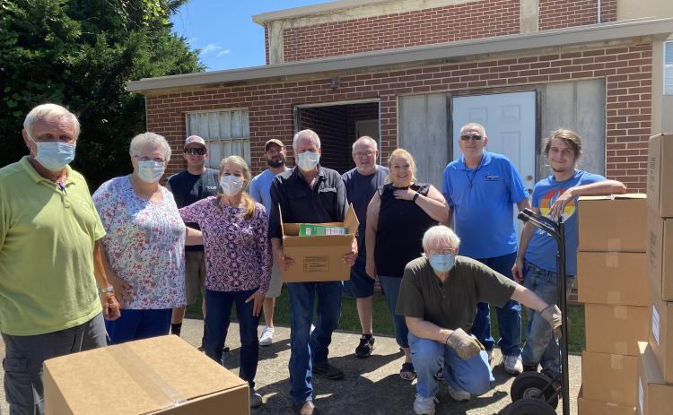 The Community Helping Hands Clinic got help from the White County School Nutrition Department, Mt. Yonah Baptist Church, White County Food Pantry and White County Rotary Club to help unload, store and ultimately distribute a donation of 225 food boxes from Americans Helping Americans. (Submitted photos)