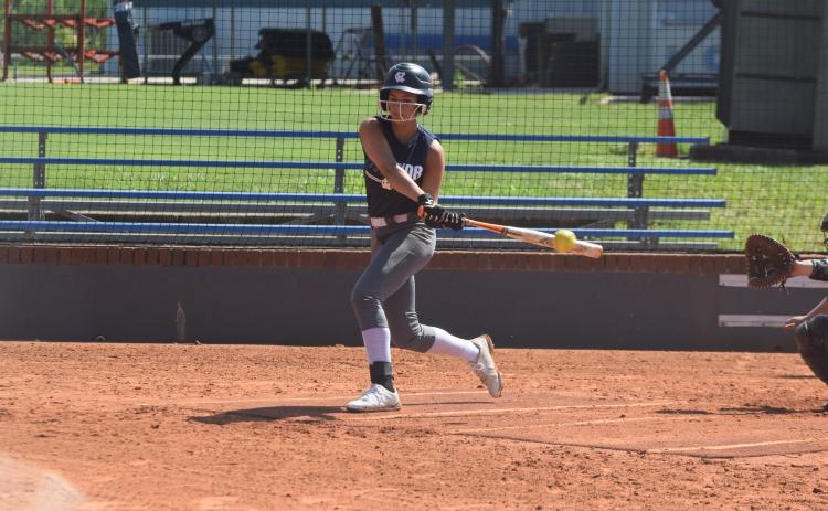 Caitlyn Gailey slaps at a pitch during an intra-squad scrimmage last week at the WCHS softball complex. (Photo/Mark Turner)