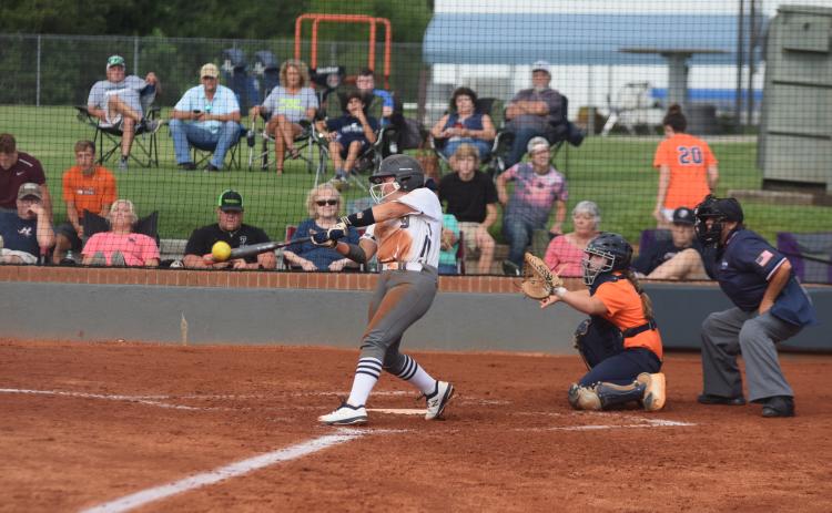 Annika Vandiver connects with a pitch during the Lady Warriors' scrimmage against Habersham Central Tuesday in Cleveland. (Photo/Mark Turner)