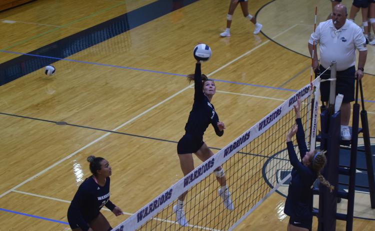WCHS senior Shelby Spain hammers a shot during the Lady Warriors' win over Lakeview Academy Tuesday night in Cleveland. (Photo/Mark Turner)