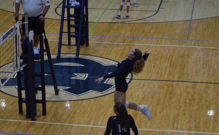 Senior Jenna Ash had a team-high 10 kills in the region opening win. (Photos/Mark Turner)