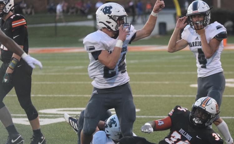Jesse Moose, left, and Reece Dockery celebrate after Moose comes up with a fumble recovery in the second quarter of the win over Hart County. (Photo/Mark Turner)