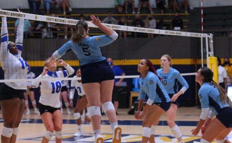 Bethany Ross, No. 5, hammers a shot at the net during the Lady Bears' opening night win over Tennessee Wesleyan Tuesday in Cleveland. (Photo/TMU Athletics)