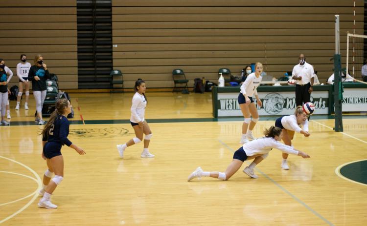 Shelby Spain, left, and Jenna Ash lunge for the ball during the Class AAA second round state tournament game agaisnt Westminister Saturday in Atlanta. (Photo/Leah Burke)