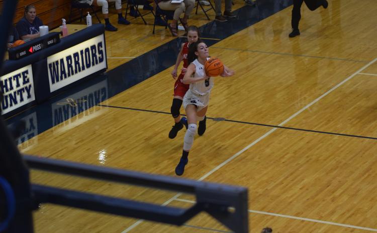 Camryn McAfee, above, and the Lady Warriors take on East Jackson in the home opener Friday night in Cleveland. (Photo/Mark Turner)