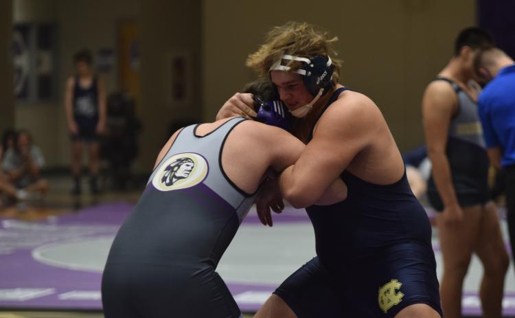 JD Trowell, right, locks up with a Lumpkin County wrestler during the Area Duals last Saturday at Cherokee Bluff. (Photo/Mark Turner)