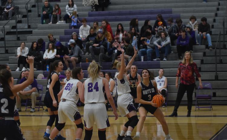 Caitlyn Gailey, right, drives along the baseline during the Lady Warriors' win at Gilmer County Tuesday night. (Photos/Mark Turner)