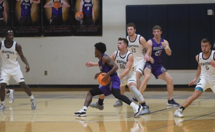 Cooper Turner guards Cherokee Bluff's Shad Dabney during the Warriors' win Tuesday night in Cleveland. (Photo/Mark Turner)