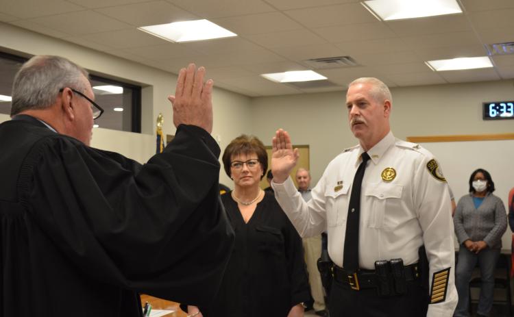 Cleveland Municipal Court Judge Garrison Baker swore in Jeff Shoemaker as the new Cleveland police chief on Monday, Feb. 8. Pictured with Shoemaker is his wife, Andrea Shoemaker. (Photo/Stephanie Hill)