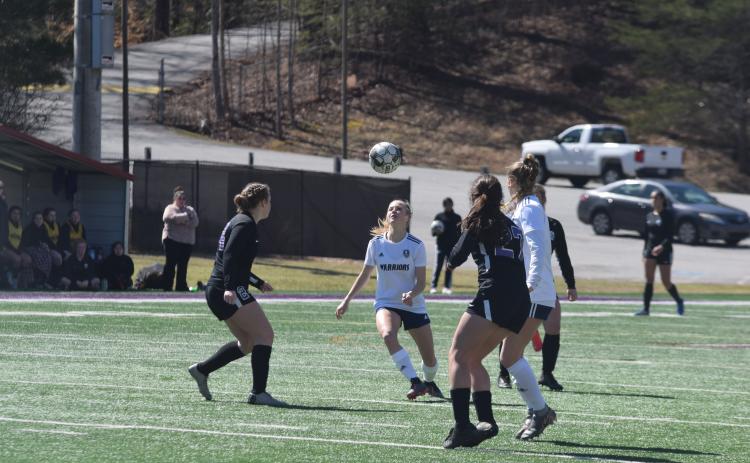 McKinley Jones, right, and the White County High School soccer team opened the 2021 season Wednesday with a non-region doubleheader against Jefferson. (Photo/Mark Turner)