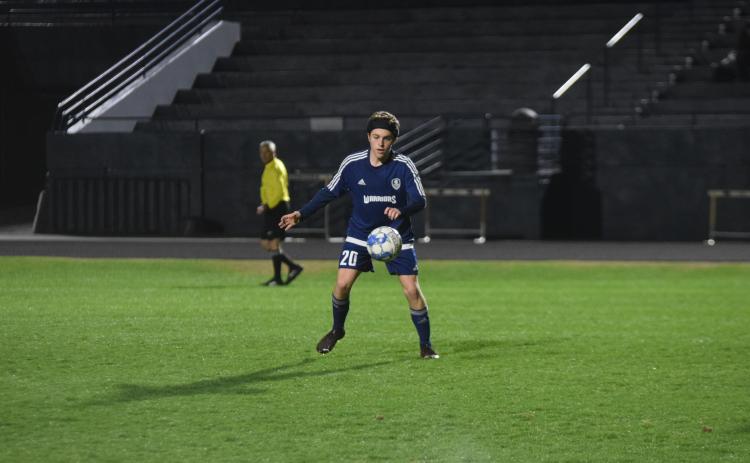 Grayson Cathey, left, and the Warriors are the only unbeaten team in the region heading into the final two stretch of the regular season. (Photo/Mark Turner)