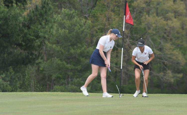 WCHS senior Catie Craig taps in a putt during the Spring Swing last Saturday in Clarkesville. (Photo/Mark Turner)