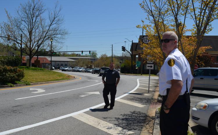 Georgia Office of Highway Safety Officer Ed Weaver (left) and CPD Chief Jeff Shoemaker monitor traffic. (Photos/Stephanie Hill)