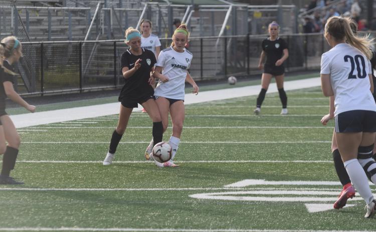 Hazen Ramey, right, set the single season scoring record Tuesday night, scoring her 25th goal of the season in the 3-0 win over North Hall. (Photo/Mark Turner)
