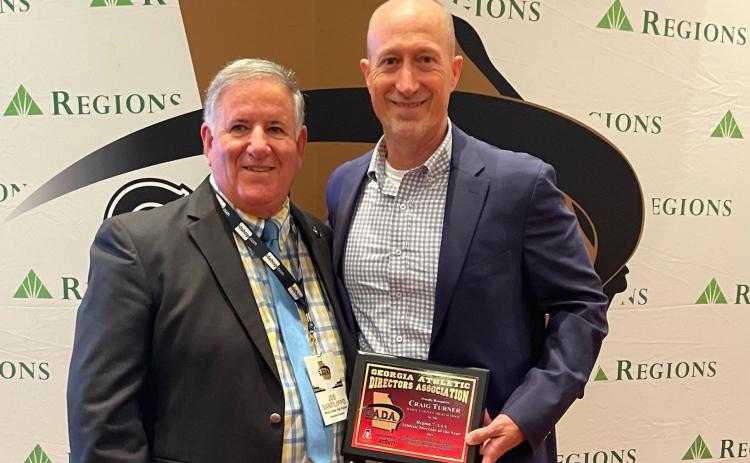 WCHS athletic director Craig Turner, right, is shown with Georgia Athletic Directors Association's executive director Joe Sanflippo during the GADA awards banquet last Saturday in Atlanta. (Photo/GADA)