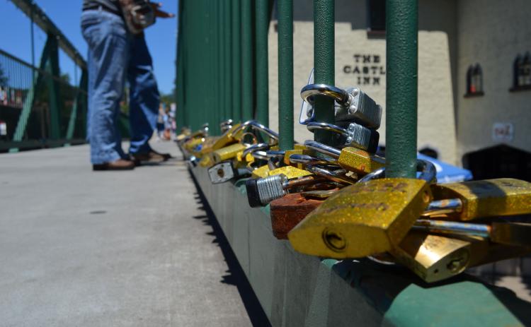 Pictured are locks that were on the bridge as of June 15. Because of the weight of all the locks over time, they have to be removed from the bridge. (Photo/Stephanie Hill)