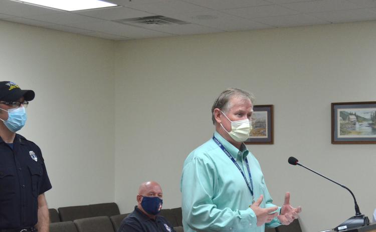 Northeast Georgia Medical Center Director of Emergency Medical Transportation Scott Masters (right) speaks to county commissioners Aug. 30, along with White County Public Safety Director David Murphy (middle) and county EMS Director Bill Scandrett (left). (Photo/Wayne Hardy)