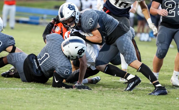 Zion McMullen, left, and Bryson Cronic, right, tackle Habersham Central's Zeke Whittington during the game last Friday night in Cleveland. (Photo/Staci Sulhoff)