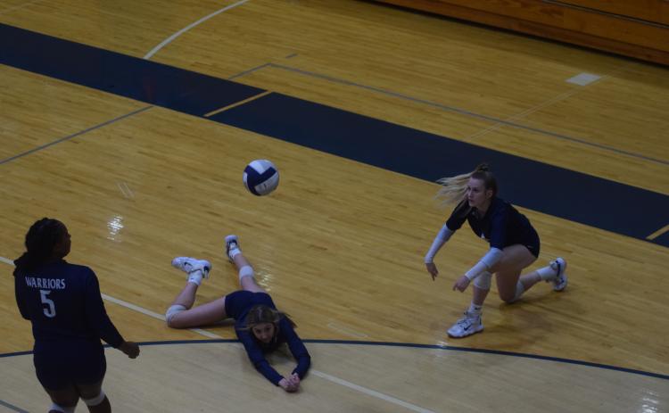 Peyton Hayse makes a diving save to keep the ball alive during the win over Gilmer County.
