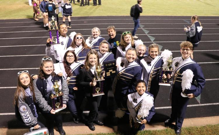 White County High School marching band members pose with some of the hardware won during their recent band competition. (Submitted photo)