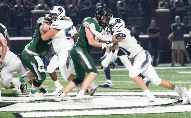 Malachi Zellars, right, battles a North Halllinemen during the game. (Photo/Staci Sulhoff)