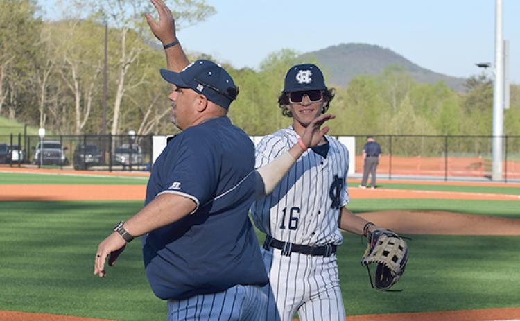 WCHS assistant coach Jason Norton, left, celebrates with Kyler Mayo during the win over Gilmer. (Photo/Mark  Turner)