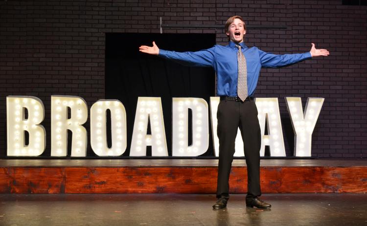 Sebastian Wiley belts out the words “gotta dance” at the opening of  the “Broadway Ballet” scene during a rehearsal for “Singin’ in the Rain.” (Photo/Samantha Sinclair)