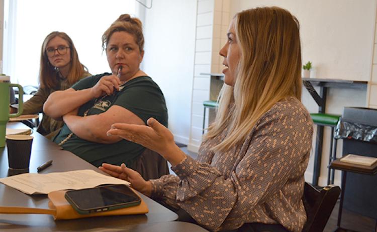 Kayla Ellis and Susie Murray listen as Marci Brown explains challenges Cleveland Drug faces. (Photo/Samantha Sinclair)