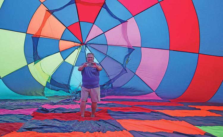 As Candy Crush is inflated for the very first time, Dave Bristol documents the occasion from inside the envelope. (Photo/Jessica Wood)