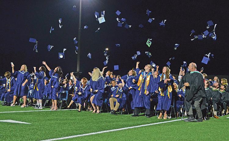 The Class of 2023 tosses their caps in the air at the conclusion of the White County High School graduation ceremony Friday night. (Photo/Samantha Sinclair)