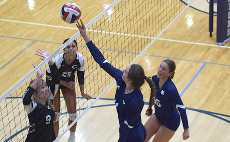 White County middle hitter Emma Kerley makes a play on a ball at the net during a match against Chestatee Tuesday at the WCHS gym. (Photo/Mark Turner)