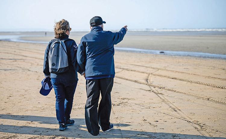 “Oh wow — the beach is so calm now. It wasn’t like this when we landed,” Virginie Durr recalls Andy Negra telling her as they looked out on Omaha Beach in Normandy. (Photo/submitted)