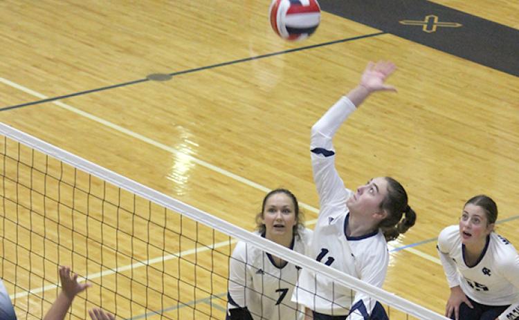 Emma Kerley goes up for a shot during the opening set of the Lady Warriors' win over West Hall. (Phot0/Mark Turner)