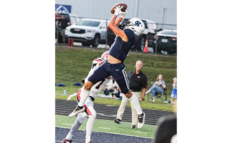 John Phillips leaps to grab a pass in the back of the end zone for a touchdown during the first quarter of the Homecoming game against Stephens County. (Photo/Staci Sulhoff)