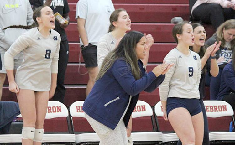 White County's Kate Blair, left, head coach Yarixa Oakes, Emma Kerley and Jalyn Allison celebrate during the Class AAA state tournament match at Hebron Christian Saturday in Lilburn. (Photo/Mark Turner)