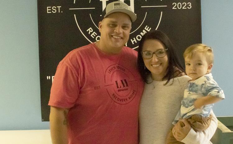 Cody and Jessica Montgomery, with their son Jaxson, help people at Levi’s House in Cleveland. (Photo/Noah Johnson)
