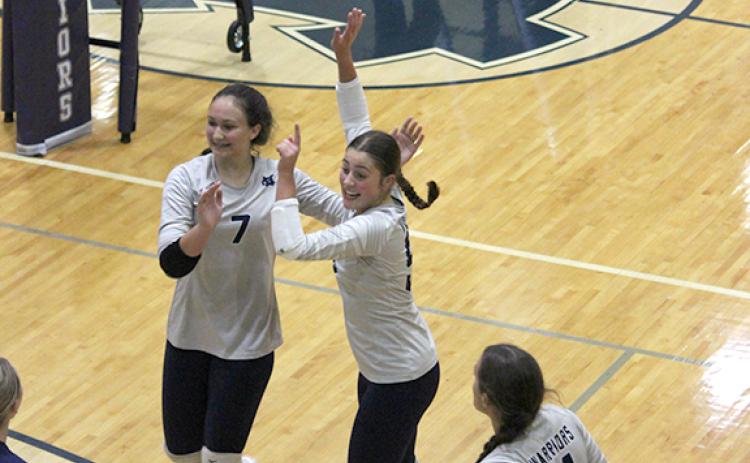 Jenna Pratt, left, and Linsey Burke celebrate during a match.  (Photo/Mark Turner)