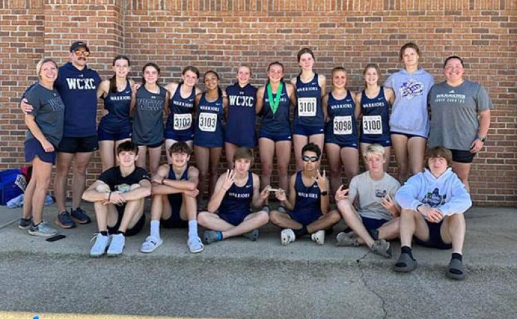 Members of the WCHS cross country teams are, front from left, Wyatt Pilgrim, Sam Gatti, Aiden Pickett, Alex Brannon, Avery Stewart and Zach Glenn; back row, coach Carrie Vandegriff, coach Matt Dover, Viktoria Milton, Alexis Kelley, Kelsey Lovell, Asia Moss, Madi Black, Emma Windham, Maddie Evans, Maggie Anglin, Josselyn Burke and Megan Runkle. (Photo/WCHS)