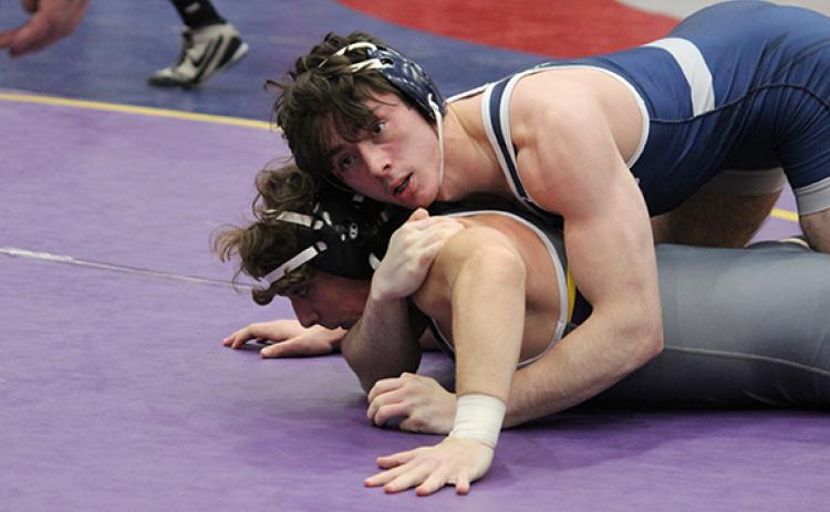 White County's Christian Keheley, top, controls Villa Rica's Mason Jones during his run to the 165-pound tournament title. (Photo/Mark Turner)
