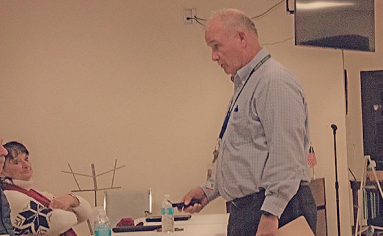 Planning Director Harry Barton sets down his recorder at the planning commission meeting for the final time. (Photo/Noah Johnson)