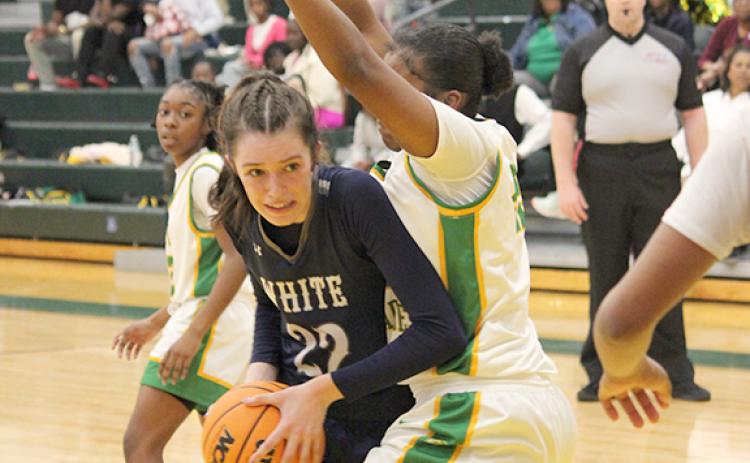 Kylie Watkins works for a shot in the low  post during the final quarter of the Elite Eight game in Monroe.  (Photo/Mark Turner)