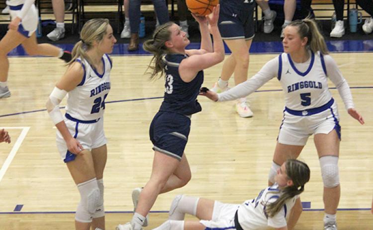 Mya Yeh goes through three Ringgold defenders on the way to the basket Tuesday during the first round of the Class AAA state tournament. (Photo/Mark Turner)