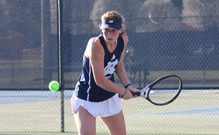 Aubrey Bolton returns a serve during her win in the No. 2 singles match Tuesday against Gilmer. (Photo/Mark Turner)
